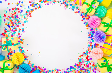 Confetti scattered in different colors on a white background. Festive confetti. The decor for the party
