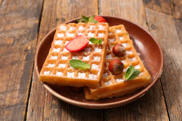 waffle with sugar and strawberry