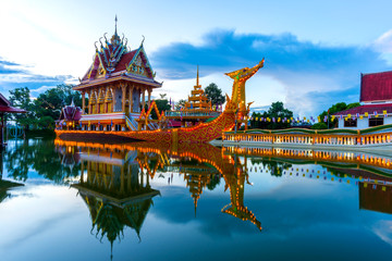 A huge Thai Suphannahong, also called Golden Swan or Phoenix boat at the WatpahSuphannahong Temple twilight time in sisaket, Thailand