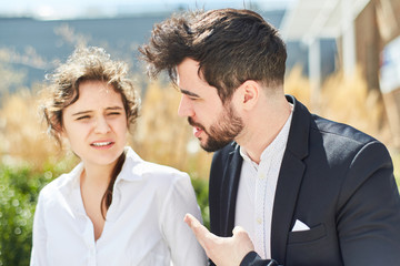 Two young business people as a team in dialogue