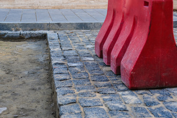 laying new granite paving stones