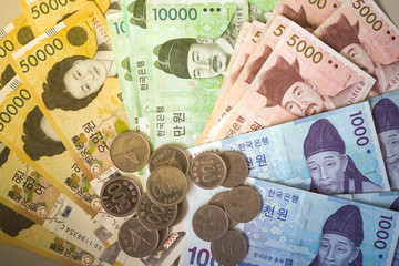 Korean won notes and Korean won coins for money concept background      
