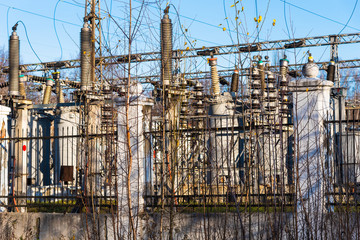 Fototapeta na wymiar Electrical substation behind the fence