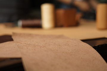 Fototapeta na wymiar close up of a raw leather on wooden cutting board.