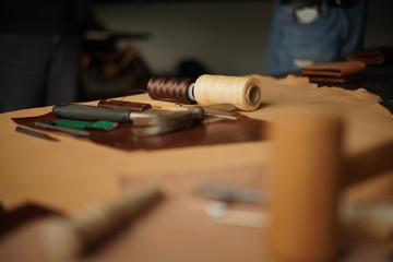 carpenter tools on wood background, leather works tool.