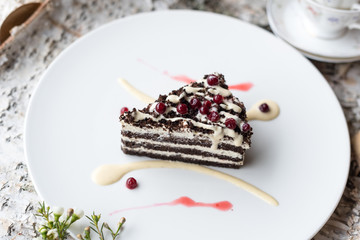 Dark Chocolate Layered Cake with Butter Cream and Lingonberry Decoration