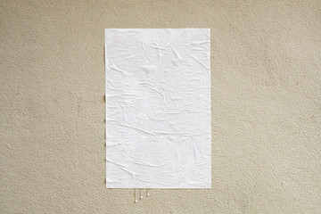 Blank white crumpled and creased adhesive street poster mockup on concrete wall background