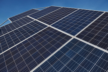 Close up view of polished surface of solar batteries at sunny daytime