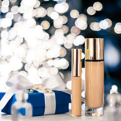 Holiday make-up foundation base, concealer and blue gift box, luxury cosmetics present and blank...