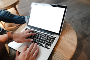 mockup image computer,cell phone blank screen for hand typing text,using laptop contact business searching information in workplace on desk at office.design creative work space on wooden desk