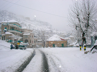 Beautiful landscape of mountainous town in winter, many cozy cottage, eco tourism,Deir El Kamar mountains in Lebanon, wintertime holidays concept