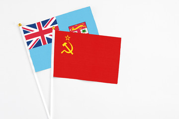 Soviet Union and Fiji stick flags on white background. High quality fabric, miniature national flag. Peaceful global concept.White floor for copy space.