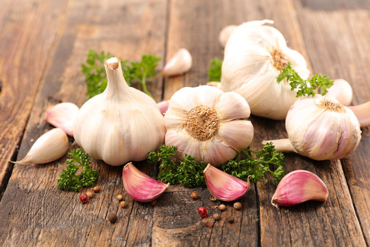 garlic clove with herb and pepper