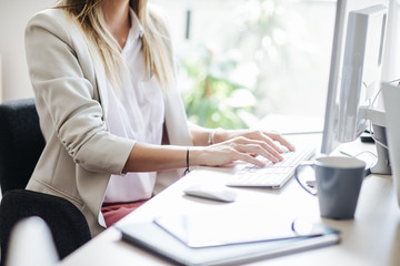 Businesswoman Working on a Desktop Computer