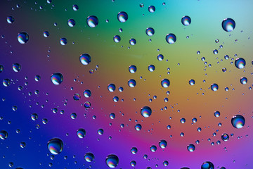 water drops on glass colorful background