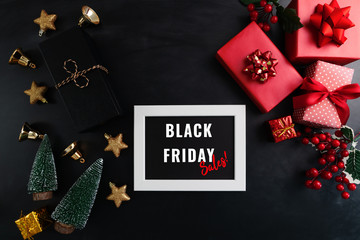 Fototapeta na wymiar gift box with photo frame for Black Friday Sale concept on black background