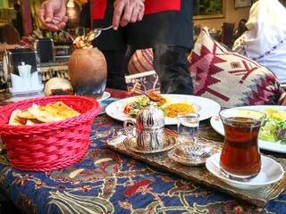 table in turkish restaurant with food tea and coffee 