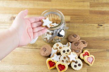 Woman takes a delicious Christmas cookie