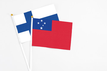 Samoa and Finland stick flags on white background. High quality fabric, miniature national flag....