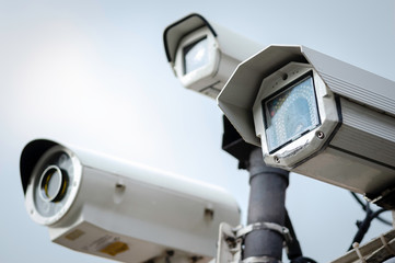 Close Up of a Security CCTV Cameras on a lamp post in the park