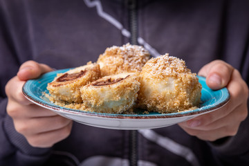 Bread crumb dumplings stuffed with chocolate and nuts