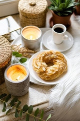 Simple real breakfast with coffee and custard cake on white plate