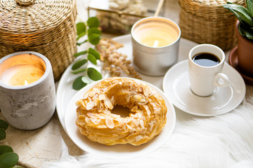 Simple real breakfast with coffee and custard cake on white plate