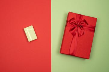 Big and small gift. Red and green background.