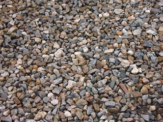gray gravel on a road of stones
