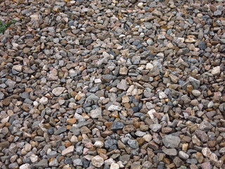 gray gravel on a road of stones