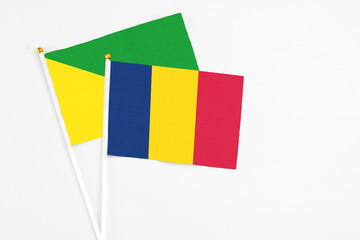 Chad and French Guiana stick flags on white background. High quality fabric, miniature national...