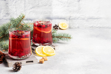 Cranberry juice with lemon and cane sugar. Winter hot drink. Copy space