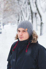 portrait of young man in winter landscape