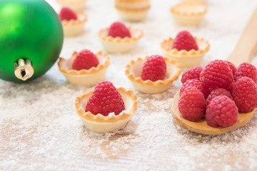 red raspberry cakes with christmas ornaments