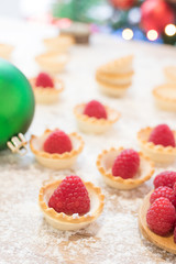 red raspberry cakes with christmas ornaments