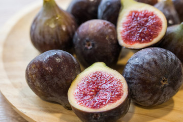 natural figs on open wooden plate