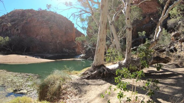 Aerial view of Ellery Creek Big Hole waterhole fed by West MacDonnell Ranges and surrounded by red cliffs. Starting point for Sections 6 and 7 of Larapinta Trail walk in Northern Territory, Australia.