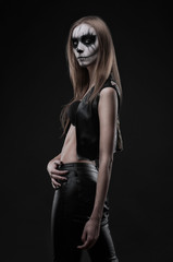 Beautiful Young sensual witch woman and fancy make-up Gothic style in a Halloween celebration...