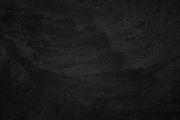  Black low contrast concrete textured wall background with roughness and irregularities to your...