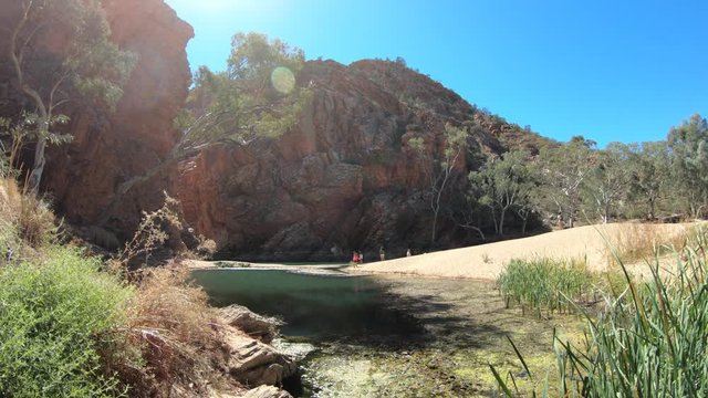Aerial view of Ellery Creek Big Hole waterhole in West MacDonnell National Parl surrounded by red cliffs. Starting point for Sections 6 and 7 of Larapinta Trail walk in Northern Territory, Australia.