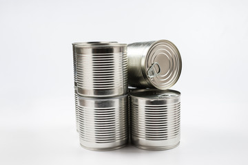 Group of silver canned food on white background.