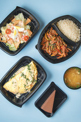  Diet meals for vegans. Set of food for delivery on a bright background.