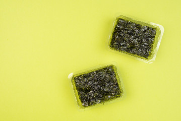 Nori seaweed on a green background. © Nikolay