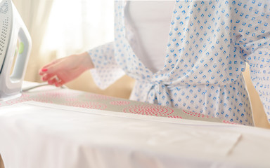 woman ironing clothes, blue colors, home decor