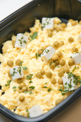 Food delivery in macro. Dishes in containers on a bright background.
