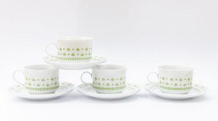 Porcelain coffee cup set - with clover pattern - isolated china ware mass product