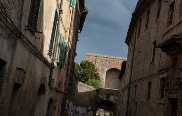 Fototapeta na wymiar Siena Italy. City wall gate Tuscany