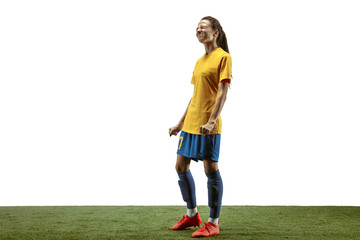 Young female soccer or football player with long hair in sportwear and boots training on white background. Concept of healthy lifestyle, professional sport, motion, movement. Upset, disappointed.