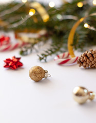 .Christmas decorative background with pine branches,candy and christmas ball on the white background. Christmas Holiday Concept. Christmas Ball Close up. Copy space