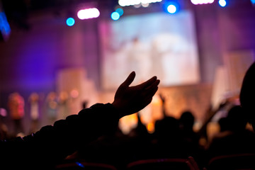a hand in church worship